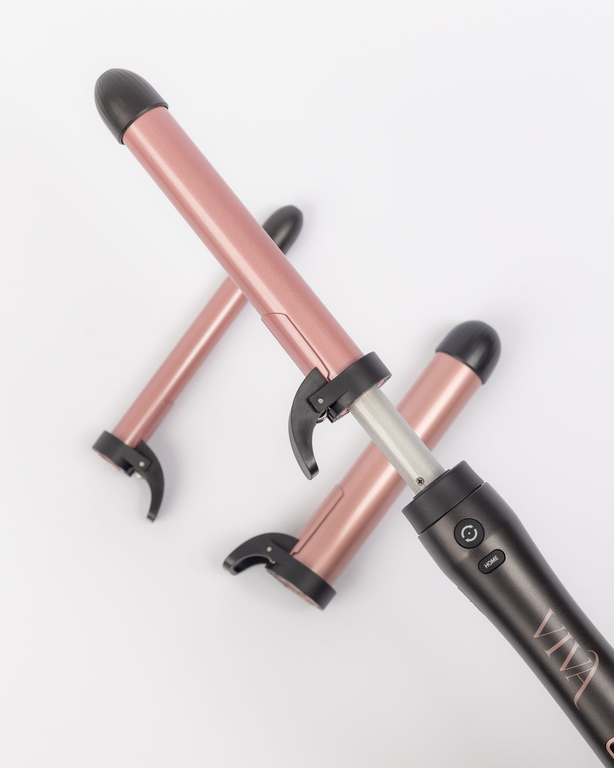 Close up for VIVA's 3 in 1 automatic rotating hair curler with three barrel sizes showcasing how it opens.